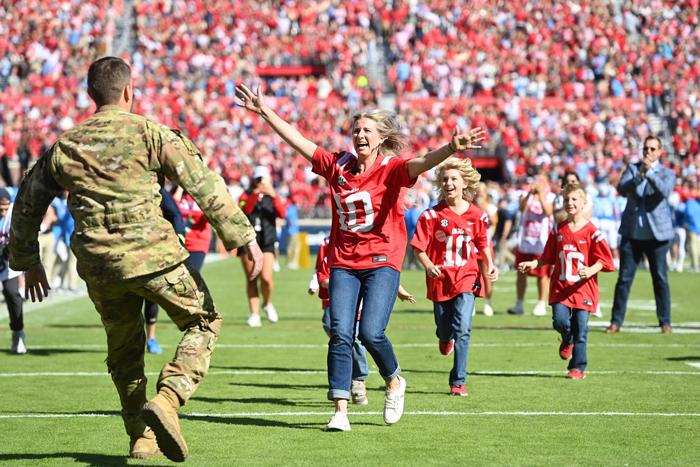 military family reunited with father